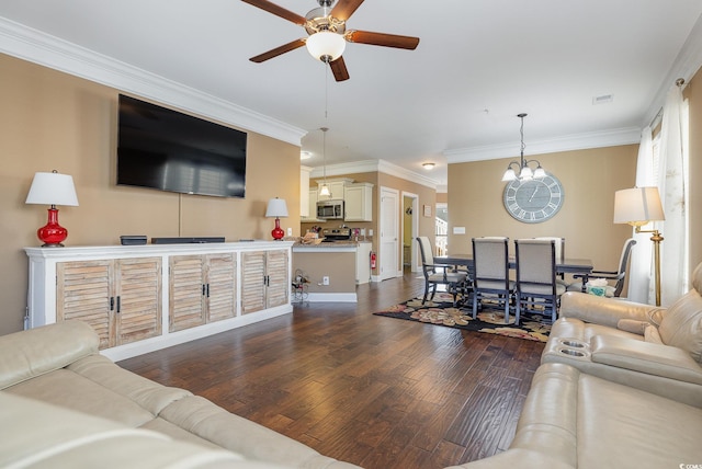 living room featuring ceiling fan with notable chandelier, dark hardwood / wood-style flooring, and crown molding