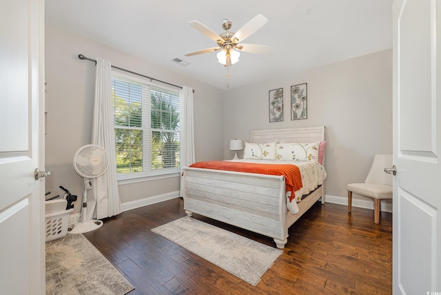 bedroom featuring ceiling fan and dark hardwood / wood-style floors