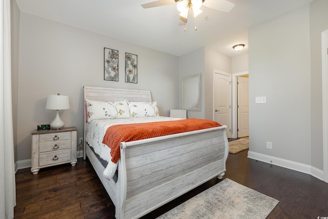 bedroom with ceiling fan and dark hardwood / wood-style floors