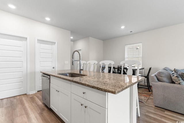 1560 Swing Bridge Way, Myrtle Beach, SC 29588 - kitchen featuring a sink, stainless steel dishwasher, light wood-type flooring, a kitchen island with sink, and recessed lighting