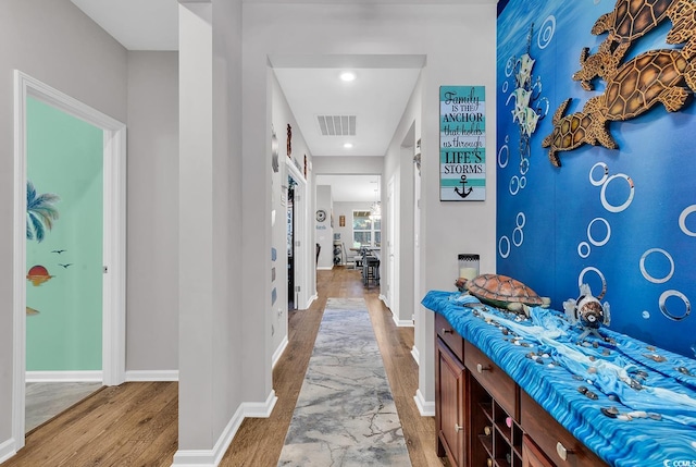 corridor featuring light hardwood / wood-style flooring