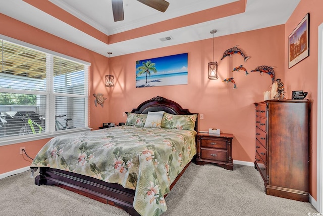 carpeted bedroom with ceiling fan and crown molding