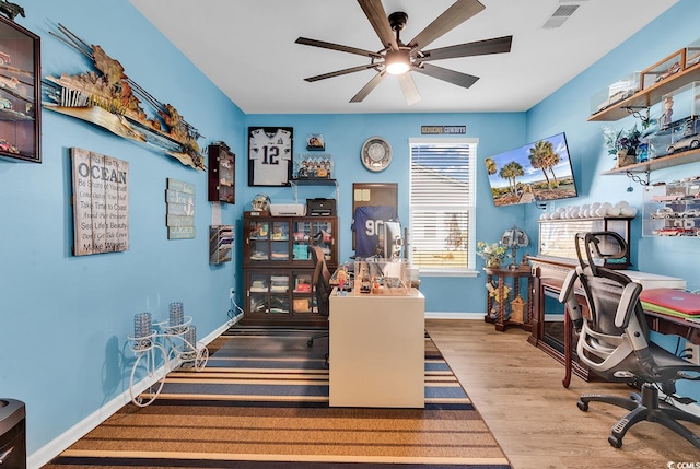 office space featuring light hardwood / wood-style floors and ceiling fan