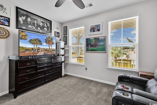 living area featuring ceiling fan and light carpet