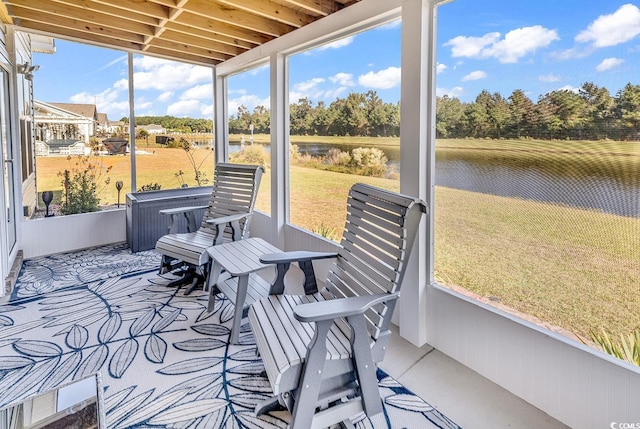 sunroom with a water view