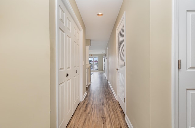 corridor featuring wood-type flooring