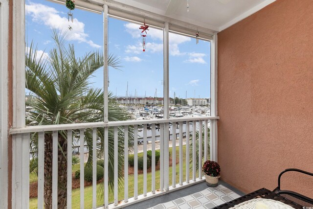 balcony featuring a water view