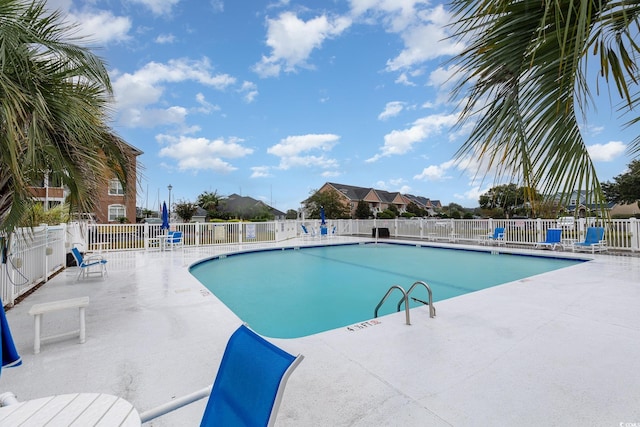 view of swimming pool with a patio area