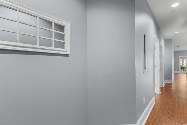 corridor featuring light hardwood / wood-style floors