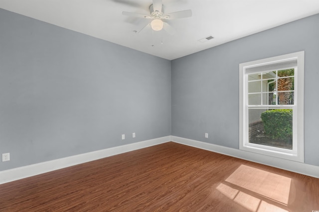 empty room with wood-type flooring and ceiling fan