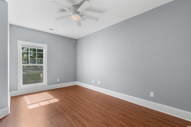 empty room with wood-type flooring and ceiling fan