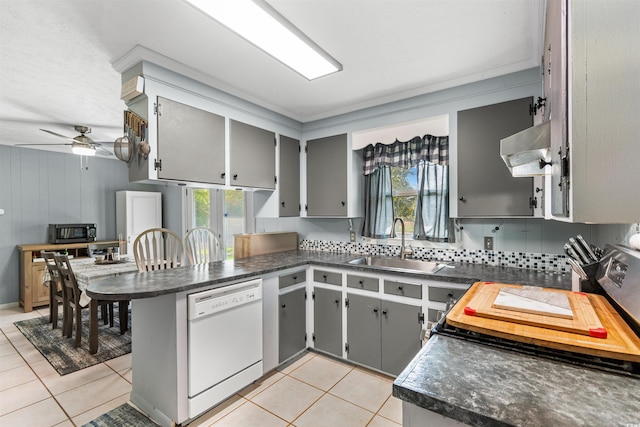 kitchen featuring sink, kitchen peninsula, ventilation hood, gray cabinets, and dishwasher