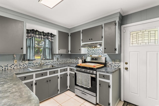 kitchen featuring gray cabinetry, crown molding, backsplash, stainless steel stove, and sink