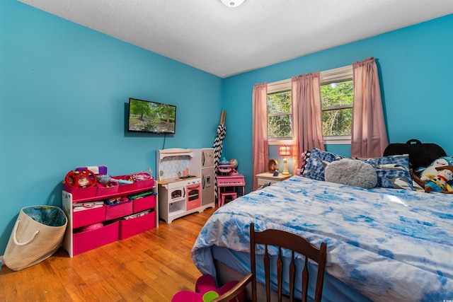 bedroom featuring hardwood / wood-style floors