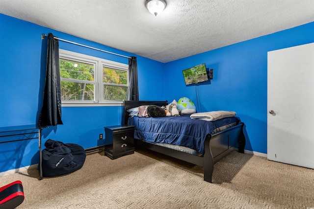 carpeted bedroom with a textured ceiling