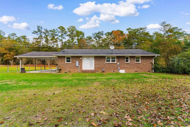 rear view of property with a lawn and a patio