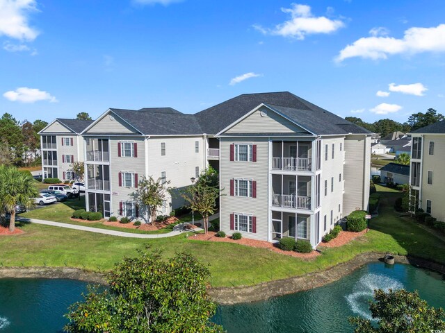 view of building exterior featuring a water view