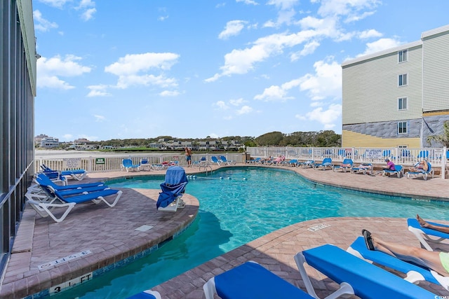 view of swimming pool featuring a patio area