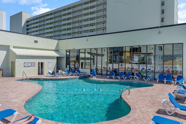 view of swimming pool with a patio area