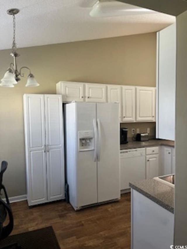 kitchen featuring white cabinetry, an inviting chandelier, decorative light fixtures, white appliances, and dark hardwood / wood-style flooring