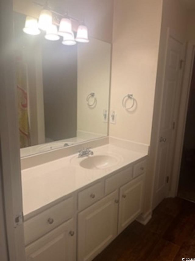 bathroom featuring vanity and hardwood / wood-style flooring