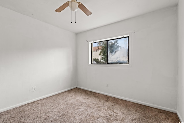 spare room with carpet floors and ceiling fan