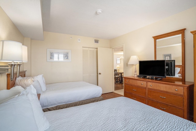 5308 N Ocean Blvd Unit 1014, Myrtle Beach, SC 29577 - bedroom with light wood finished floors and a closet