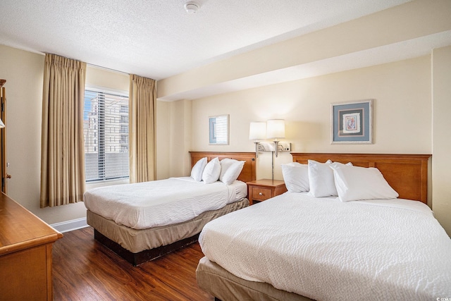 5308 N Ocean Blvd Unit 1014, Myrtle Beach, SC 29577 - bedroom featuring dark wood-type flooring and a textured ceiling