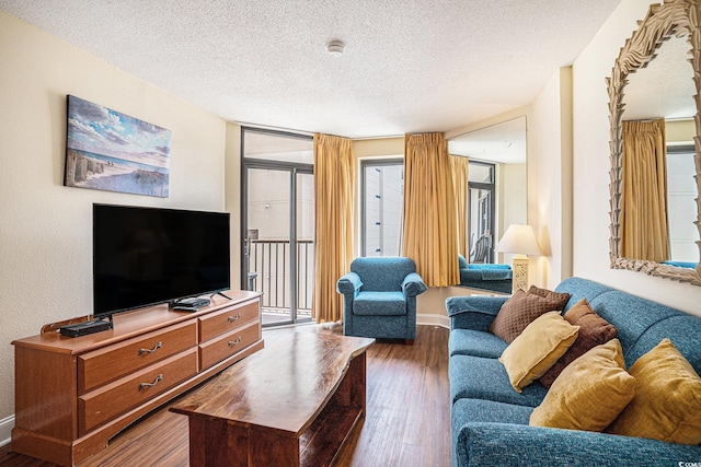 5308 N Ocean Blvd Unit 1014, Myrtle Beach, SC 29577 - living area featuring a textured ceiling, dark wood-type flooring, and baseboards