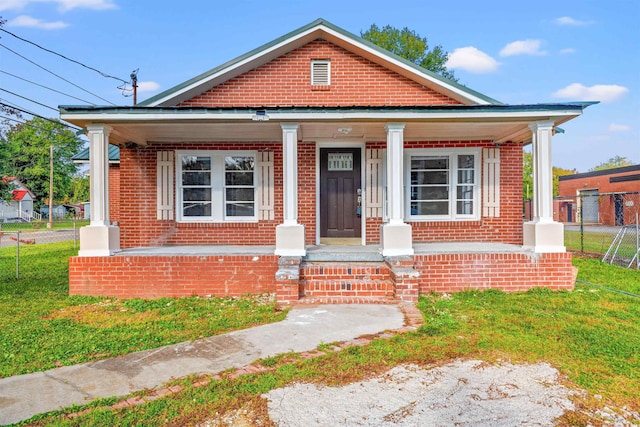 bungalow-style home featuring a front yard