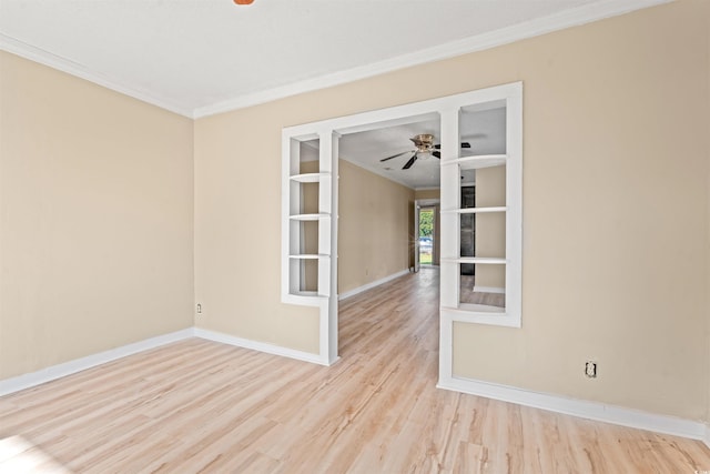 spare room featuring ceiling fan, light hardwood / wood-style floors, and ornamental molding