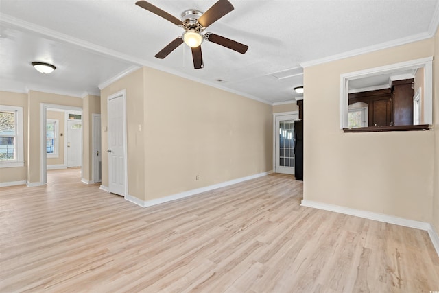 empty room featuring light hardwood / wood-style floors, ceiling fan, and crown molding