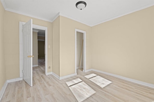 unfurnished bedroom with crown molding and light hardwood / wood-style flooring