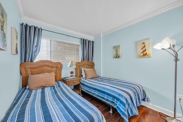 bedroom with crown molding and dark hardwood / wood-style flooring