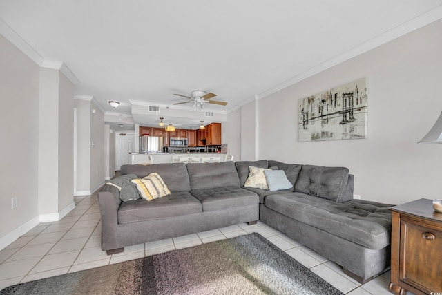 tiled living room featuring ceiling fan and crown molding