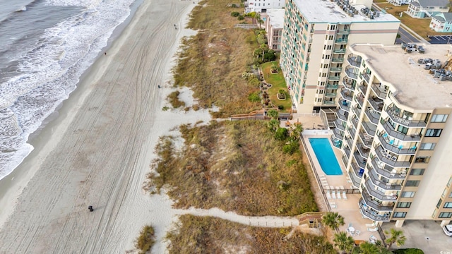 drone / aerial view with a beach view and a water view