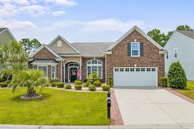 view of front of home featuring a front yard and a garage