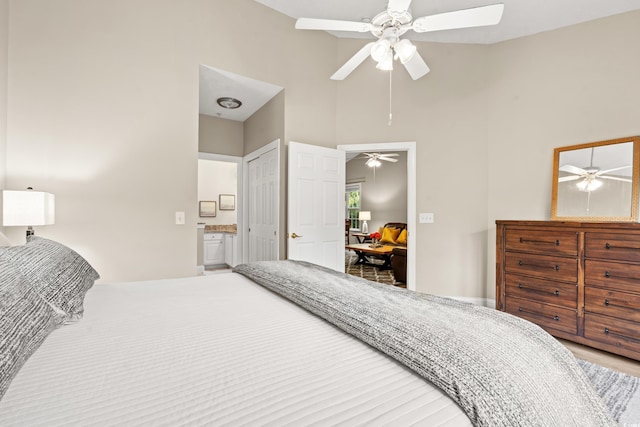 bedroom with high vaulted ceiling and a ceiling fan