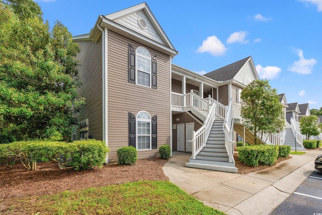 view of front of home with stairs