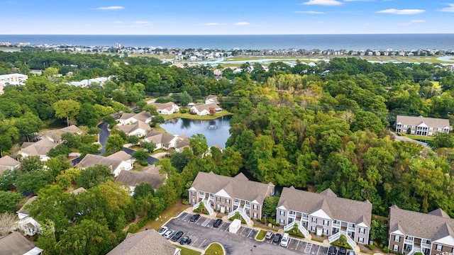 drone / aerial view with a residential view and a water view