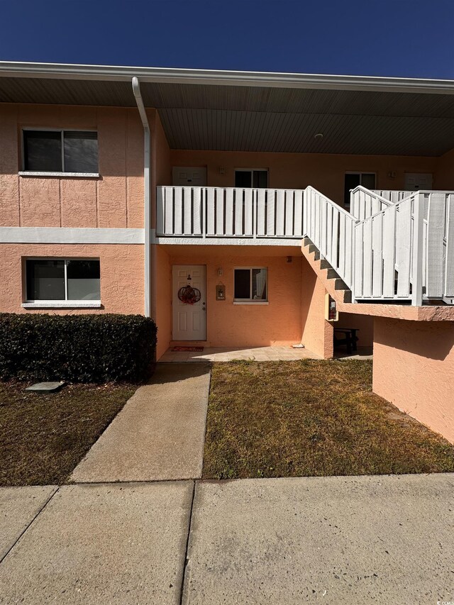 doorway to property featuring a balcony