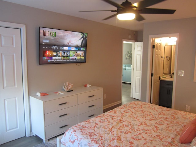 bedroom with ensuite bathroom and ceiling fan