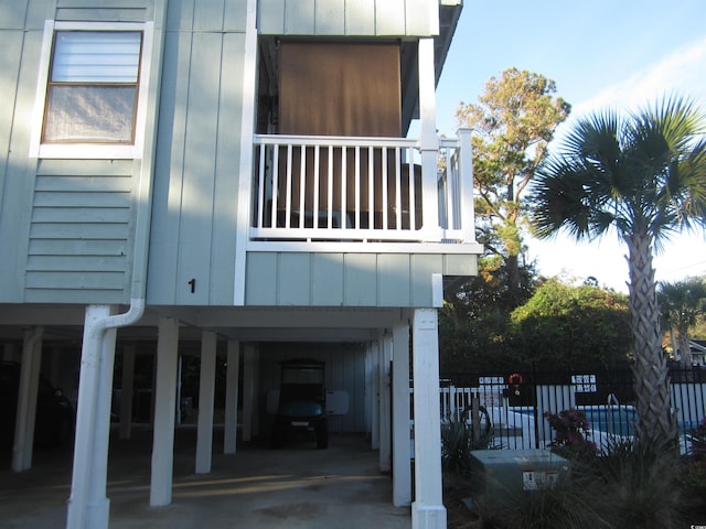 view of side of home with a balcony