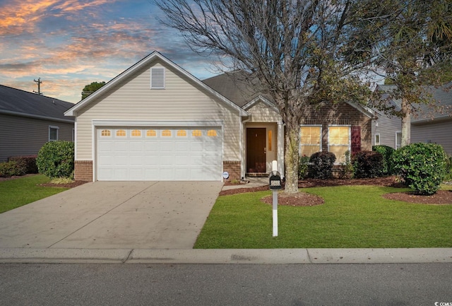 single story home with a garage and a lawn