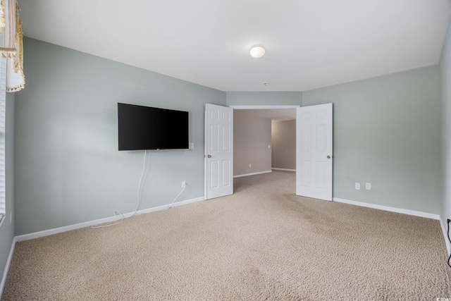 spare room featuring carpet floors