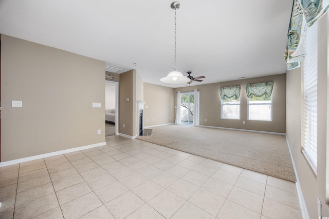 carpeted empty room with ceiling fan