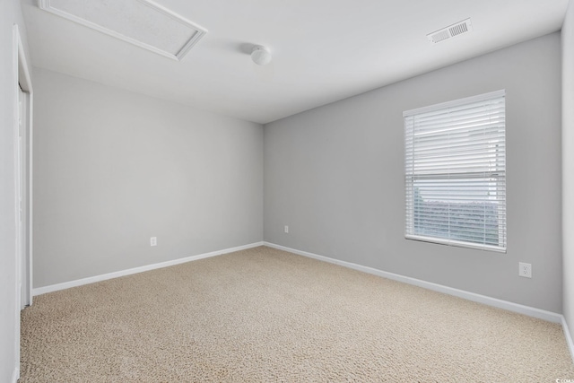 unfurnished room featuring carpet flooring