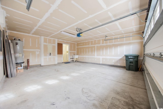 garage featuring a garage door opener and electric water heater