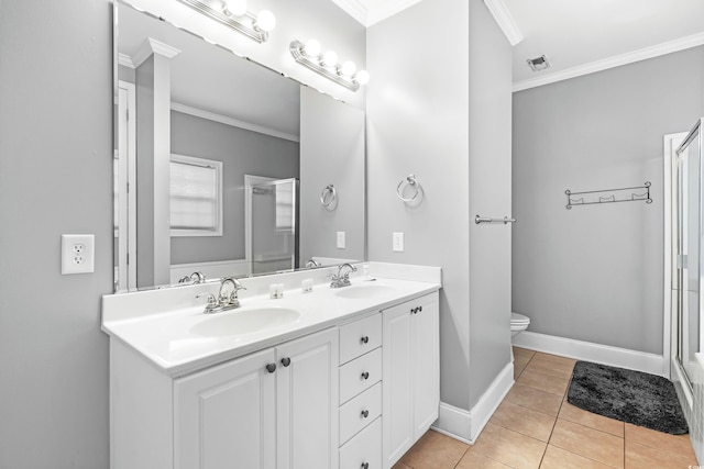 full bath featuring crown molding, tile patterned flooring, a sink, and a shower stall