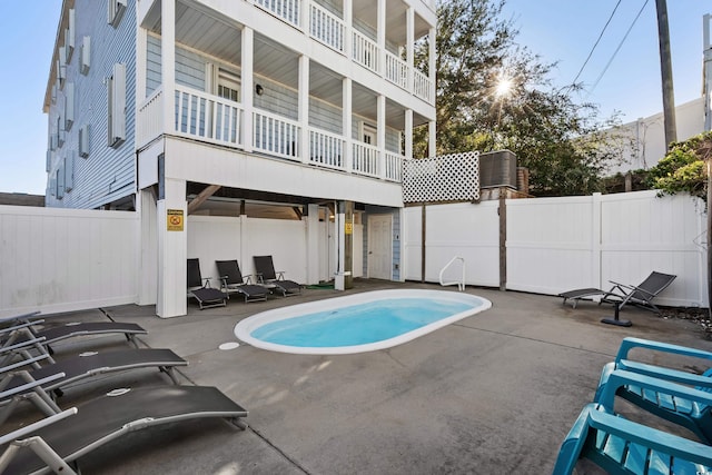 view of pool with a fenced in pool, a patio area, and a fenced backyard